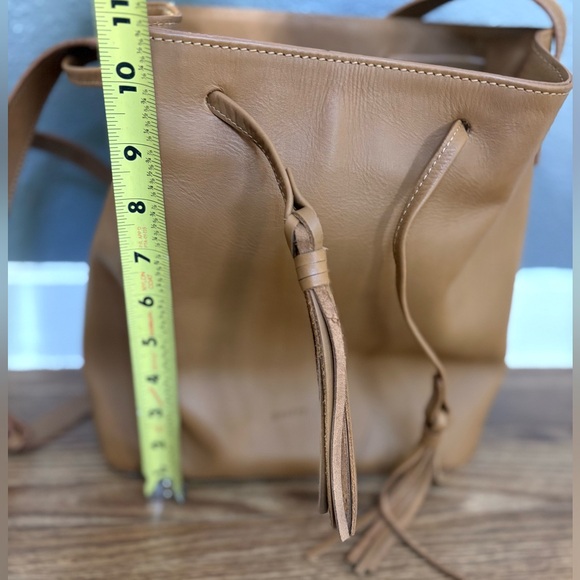 - [ ] Poetry Tan Leather Bucket Bag with Tassels - Picture 9 of 10